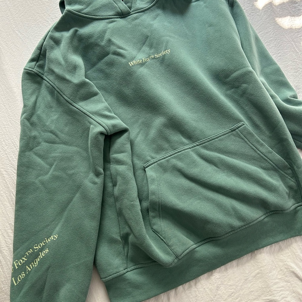 White fox teal hoodie